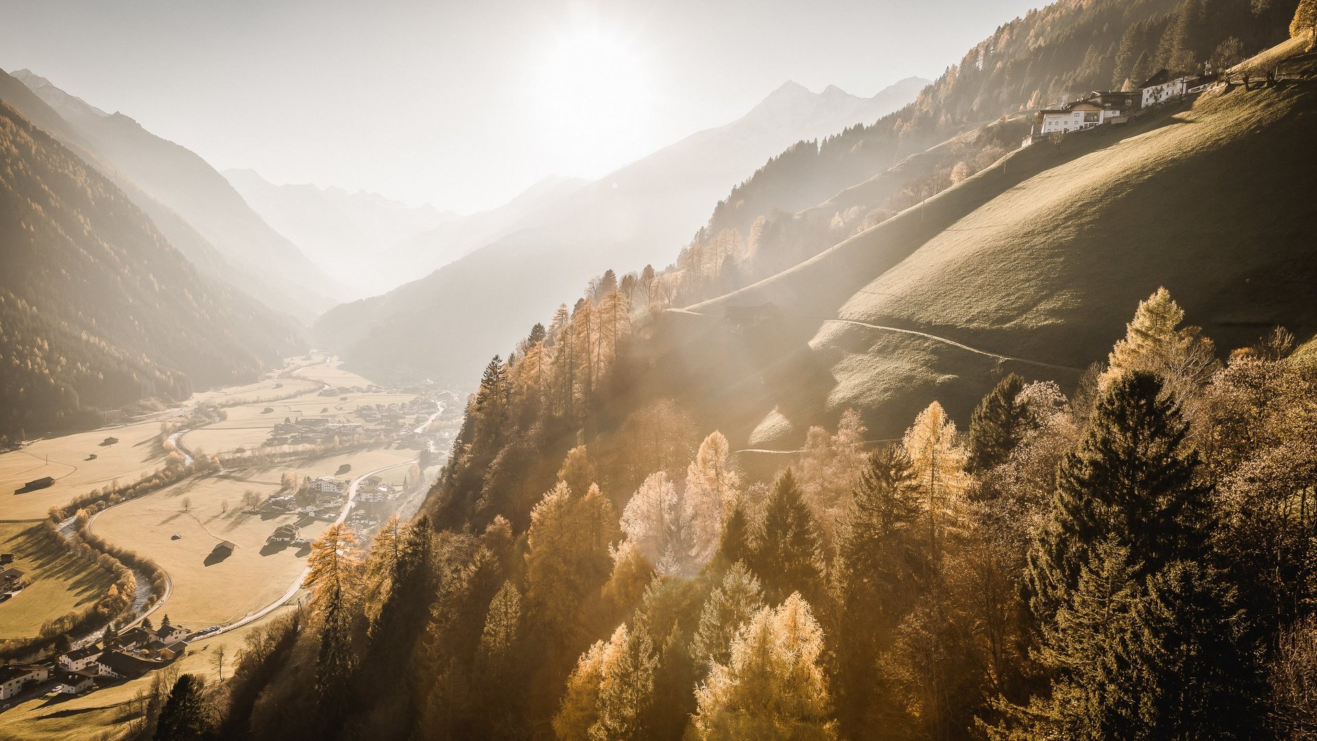 Your apartment for a Stubaital summer holiday ☀ Sunlight over autumn mountain valley with houses and forest