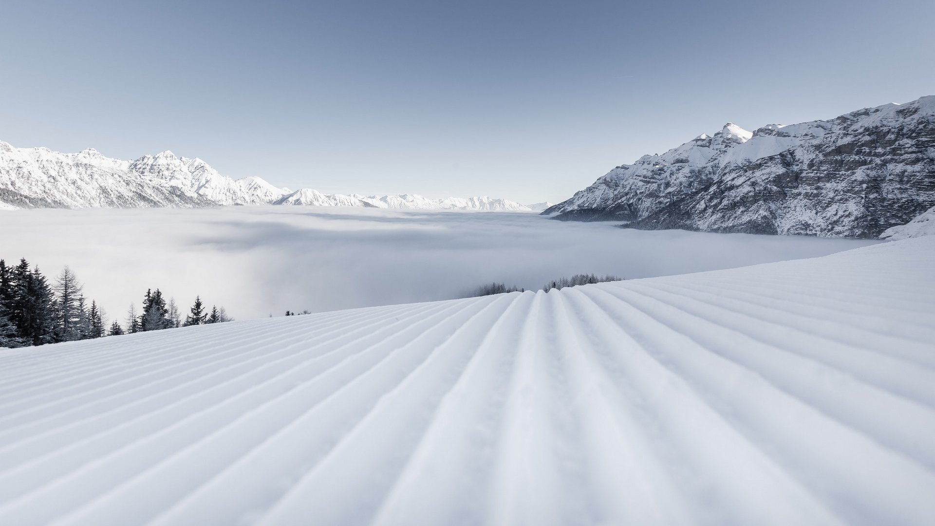 Your holiday apartment in Neustift ✓ Groomed ski slope with snowy mountains and foggy valley